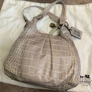 Authentic Coach Crocodile Leather Handbag
Light grey with a lilac hue